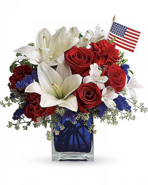 Bouquet of red, white, and blue flowers with an American flag