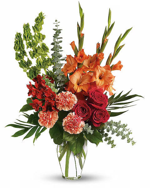 Assorted flowers in transparent vase