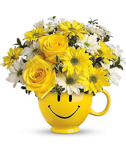 Happy face cup with yellow flowers